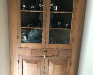 Exceptional 1860 walnut corner cabinet With original glass.