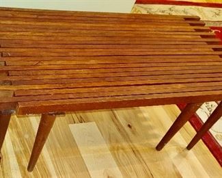 $475 Mid century expandable teak coffee table  40" L by 18 inches wide by 15" high.  60 inches fully extended - AS IS some discoloration