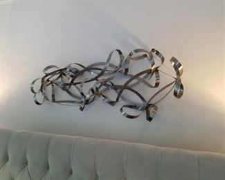$175 /  Metal ribbon abstract wall art (originally from Wayfair). Measurements: 57" wide x 24" tall