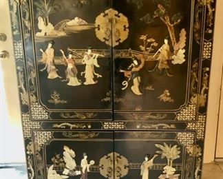 Gorgeous Music cabinet....excellent condition. carved stone musicians all over carving even on the inside of the doors with inlay mother of pearl $1200.00