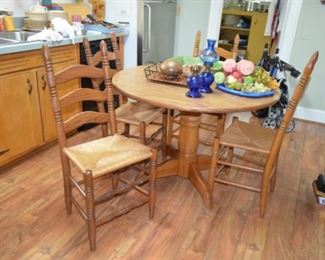 oak pedestal table w/4 oak chairs w/rush seats