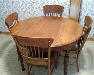 vintage solid wood table and four chairs