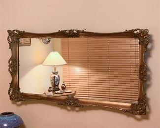 Lot #821 - $300 - Antique Mirror with Ornate Frame (42" L x 21" H, frame has some blemishes)