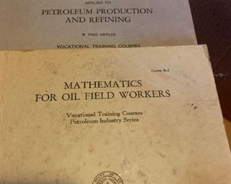 Many oil field, oil rig related books, papers, pens