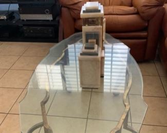 Glass top coffee table with wrought iron base