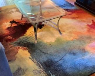 Glass and metal table, contemporary rug