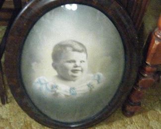 One Fat Kid. I think it is a boy in a dress. They did that back then.