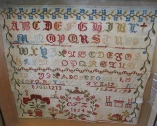 Sampler dated 1854.