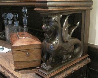 Heavily carved oak & stained glass Cupboard/Buffet de Corps with lights and carved Winged Griffins.