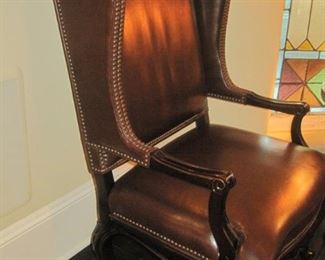  A pair of Wing Back Leather Armchairs.