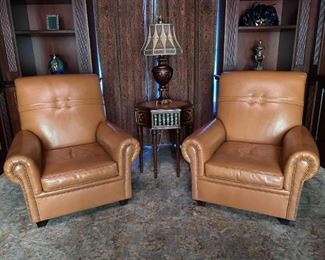 Pair of vintage leather lounge chairs (matching ottoman)