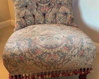 Upholstered slipper chair with fringe
