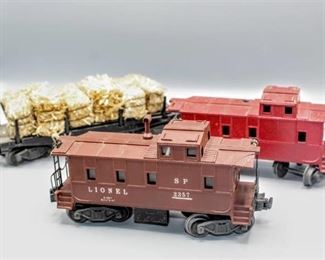Lionel Train O Scale Trains (3), SP 2357 Caboose, Unmarked Caboose missing Smokestack and Brake Wheels, and Automatic Lumber Car Hauling Hay 3461