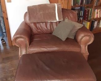 Large brown leather chair with ottoman