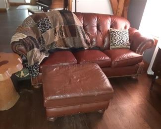 Brown leather sofa with ottoman