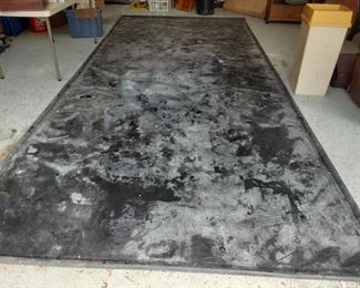 Garage floor cover catches melting snow and rain