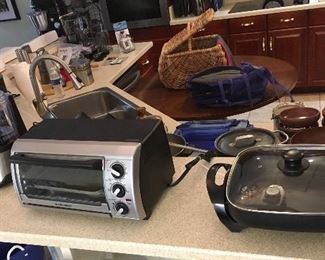 Several Clean working Kitchen Small Appliances Cookware.