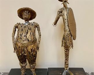 Item 18:  Mixed Media Sculptures Marked Makler (Puerto Rico) There are some condition issues - man on right is missing part of shoe:    $30 for Pair                                                                            
Small - 8.75"l x 4.5"w x 16"h                                                                              Large - 8.75"l x 4.5"w x 20"h               