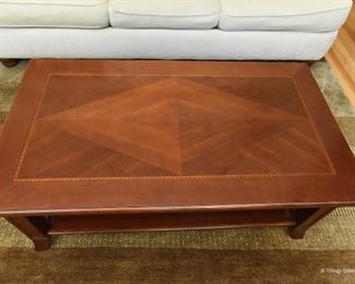 Coffee table  $95
Wood with iron details. Bookmatched top in form of diamond. 4’2" long x 1'8" tall x 2'4" wide