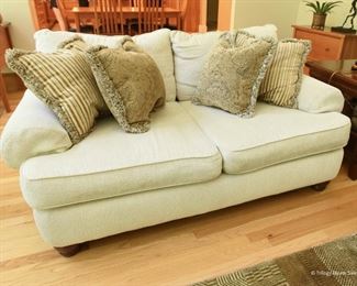 Off-White Loveseat  $100
Some wear. There’s a pull on one of the cushions as shown. 6’ x 3’ x 3’8”