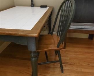 Tile-top table and chairs $150
Green legs, green chairs. 