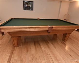 Brunswick Billiards Table - accepting offers. It's in excellent condition, large billiards size. Leather pockets. Includes balls and cues. 9'2" long  x 2'8" tall x 5' wide