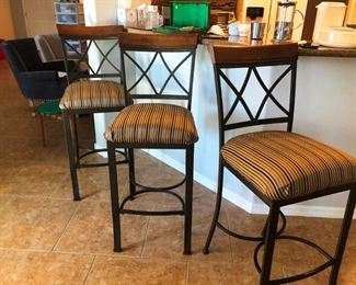 Four tall upholstered bar stools