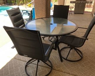 Patio set with 4 swivel chairs