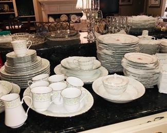 three large set of white dishes