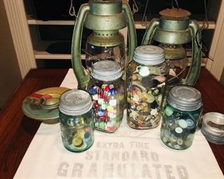early marbles, buttons, lanterns and a cute Plaquemine sugar sack