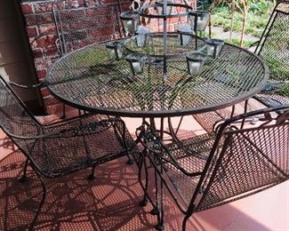 patio furniture including this table and four chairs