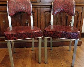 PAIR OF BRUSHED STAINLESS STEEL CHAIRS WITH RED VINYL SEATS