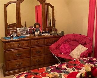 Queen Size Bed, Comforter, Throw Pillows, Nightstand, Assorted Linens, Fold Up Pink Chair, Dresser with Mirror, Baby Doll