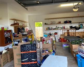 Assorted Garage Items, Refrigerator, Assorted Cleaning Agents, Stuffies, Shelving