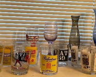 Booze label glasses, colored glass vases - big purple one on far right is Italian