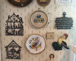 Kitschy wall decor: Aztec calendar clock, Schweizer pewter plaques,  Deruta Italian plate, rooster wall pocket & more