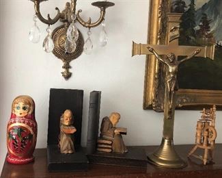 Russian nesting doll, German wooden monk bookends, tall brass crucifix, mini spinning wheel (N.B. Brass sconce with crystals is not for sale - it’s part of house)
