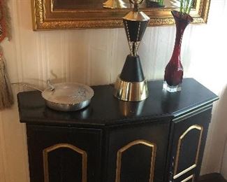 Black cabinet, mid-century lamp, gilt frame mirror (29” x 35”)