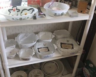 German items (measuring cone, coffee/spice grinder), cylindrical grater, Corning Ware + CW “Electromatic” skillet (on floor)