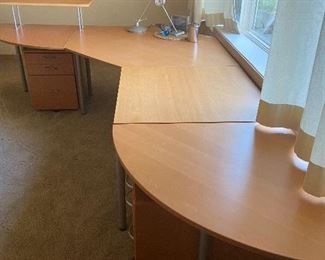 Modern desk, can be two sections. File cabinets under the table. $175.00 great condition. 