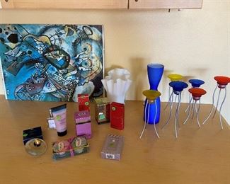 misc. perfumes , modern art print,  candle holders.