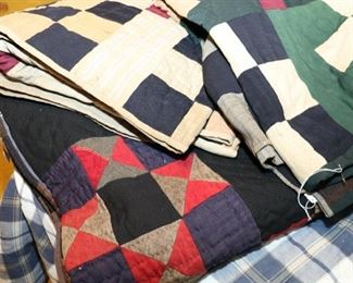 Antique hand sewn quilts.  The darker color quilt is in really good condition for the age.  