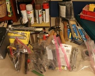 Wrenches, pliers, screwdrivers and other tools.  Electric chainsaw, Craftsman battery powered tool set
