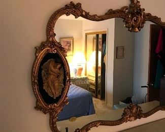 This Mirror is awesome.  Detail has Plaster of Paris Figure onlays on either side