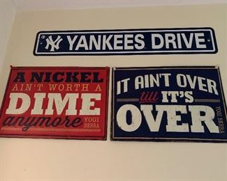 Many tin signs throughout house -Yankees, Yogi Berra 