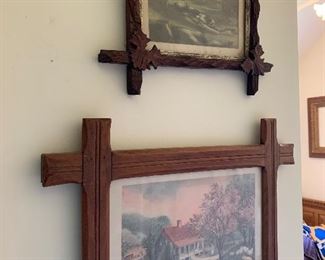 Antique prints in antique frames with leaf clusters