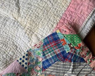 Unfinished quilt top and a plain white flour sack quilt  with a pink border