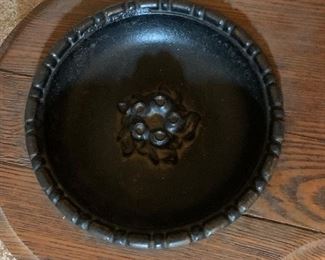 Metal bowls to catch dripping umbrellas in hall tree