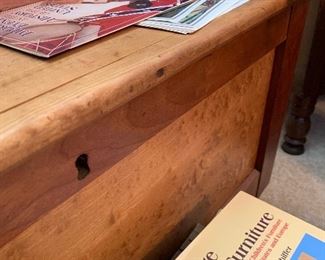 Chestnut blanket chest buried under the books