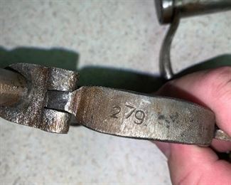 279 engraved on what look like hand made handcuffs 
